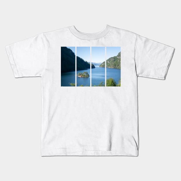 Wonderful landscapes in Norway. Beautiful scenery of a island with a red house on the Lovrafjorden fjord. Mountains with snow in background. Sunny day Kids T-Shirt by fabbroni-art